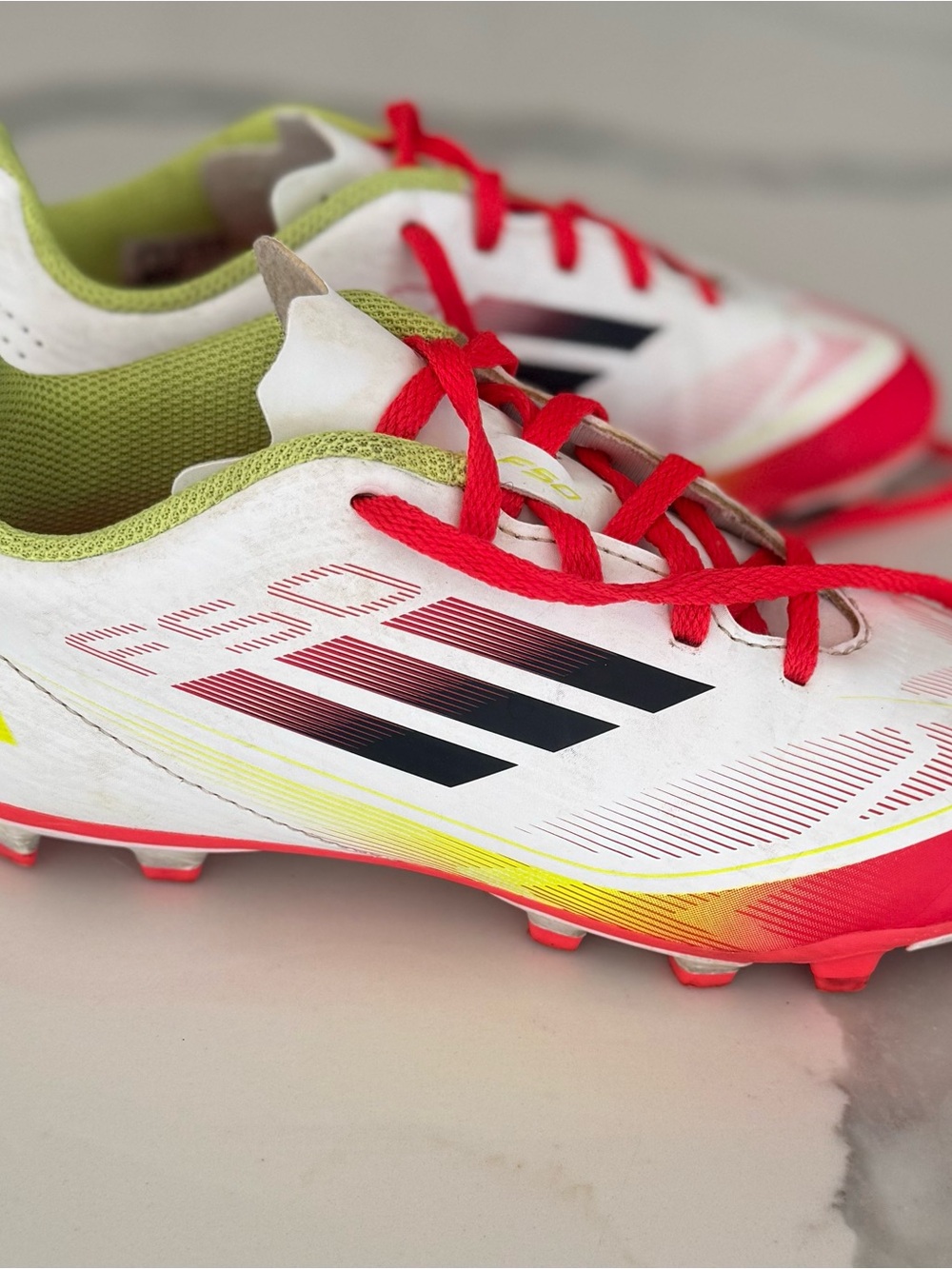 Adidas Youth F50 White Soccer Cleats with Red,Yellow, Green Accents